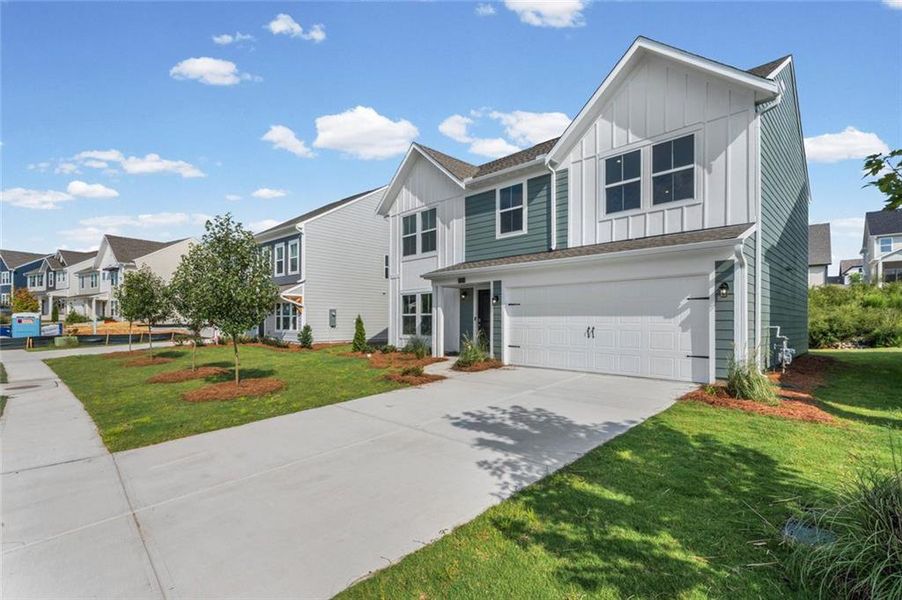 Front exterior of a new home in Twin Lakes, Hoschton, GA, highlighting curb appeal (Image 19).