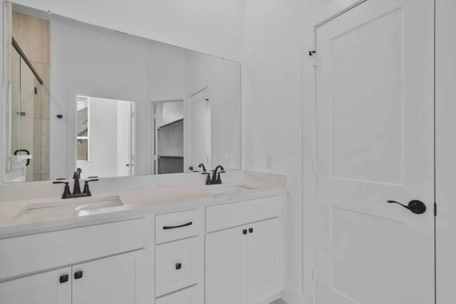 Representative furnished interior of a home built from the Versailles by Chesmar Homes in Meridiana Chateau, Manvel (Image 8).
