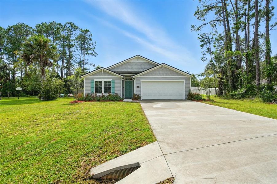 Front exterior of a new home in Palm Coast Homesites, Palm Coast, FL, highlighting curb appeal (Image 26).