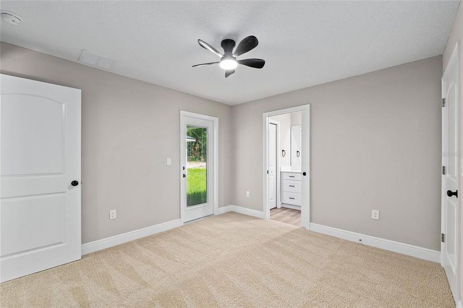 bedroom with full bathroom and linen closet