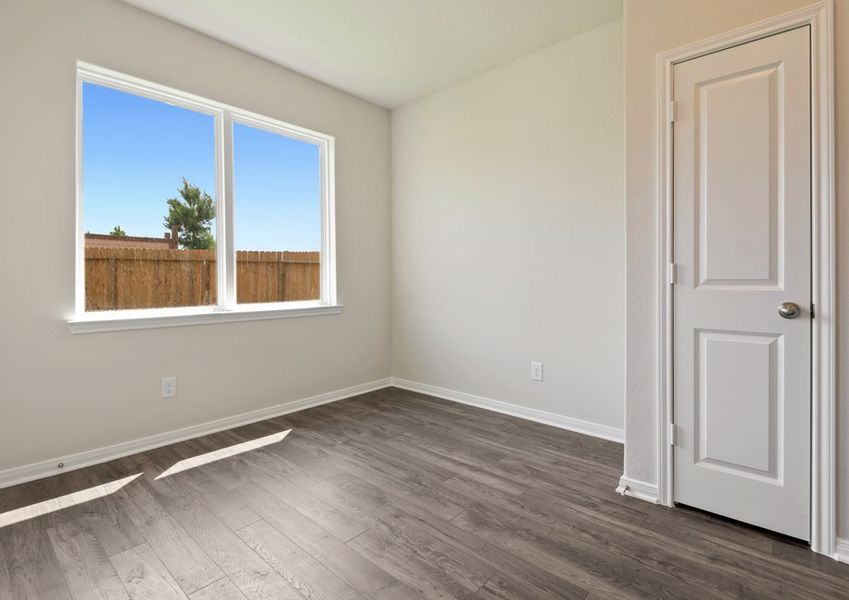 Dining room with a window overlooking the backyard