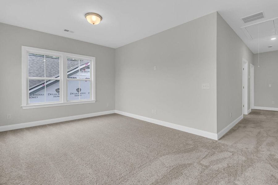 Spacious, unfurnished interior of a new home in Tidewater at Lakes of Cane Bay, Summerville (Image 21).