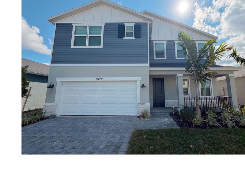 Front exterior of a new home in Brystol at Wylder - Reserve Series, Port St. Lucie, FL, highlighting curb appeal (Image 2).
