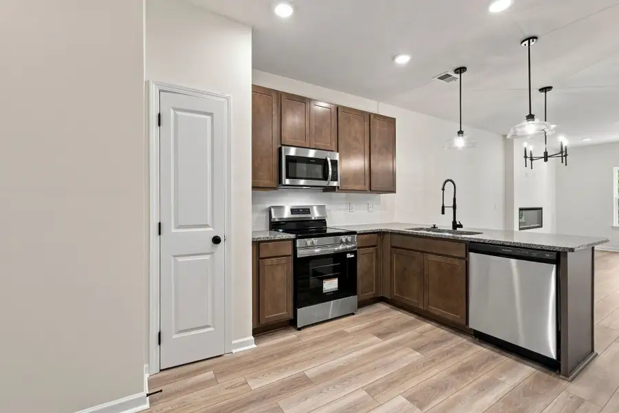 These pictures are of another unit of the same floor plan. Design selections will vary.