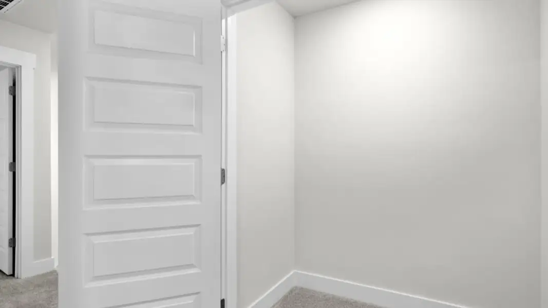 Spacious, unfurnished interior of a new home in The Townes at Cedar Hill Landing, Navassa (Image 28).
