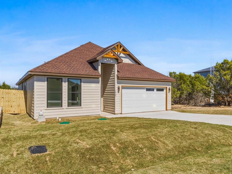 Front exterior of a new home in , Granbury, TX, highlighting curb appeal (Image 16).