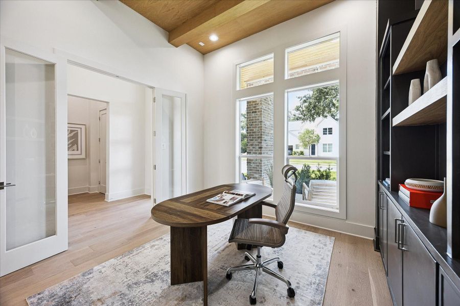 French doors open to a flexible study or 5th bedroom where white oak ceiling beams, custom millwork and recessed lighting add warmth and character. Wide plank engineered white oak flooring continues throughout, while a walk-in closet and nearby full bathroom make the space equally suited for the at-home professional or overnight guests.