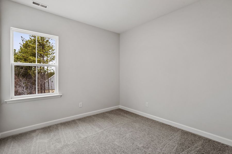 Spacious, unfurnished interior of a new home in Sweetbrier, Durham (Image 27).