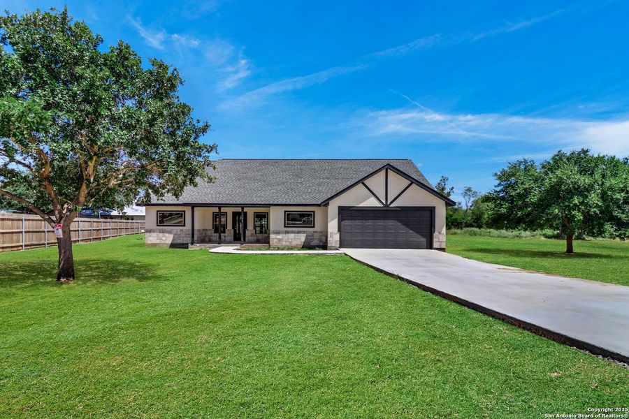 Front exterior of a new home in , Lytle, TX, highlighting curb appeal (Image 27). Front exterior of a new home in , Lytle, TX, highlighting curb appeal (Image 27).