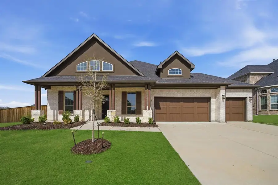 Front exterior of a new home in Sonoma Verde, Rockwall, TX, highlighting curb appeal (Image 21). Front exterior of a new home in Sonoma Verde, Rockwall, TX, highlighting curb appeal (Image 21).