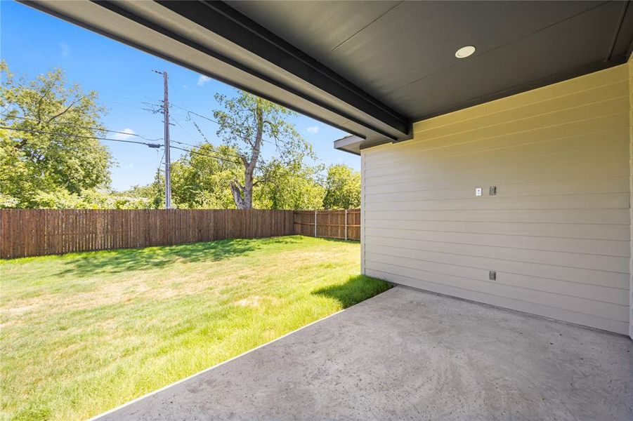 Covered patio with concrete flooring, recessed lighting, and a horizontal plank exterior