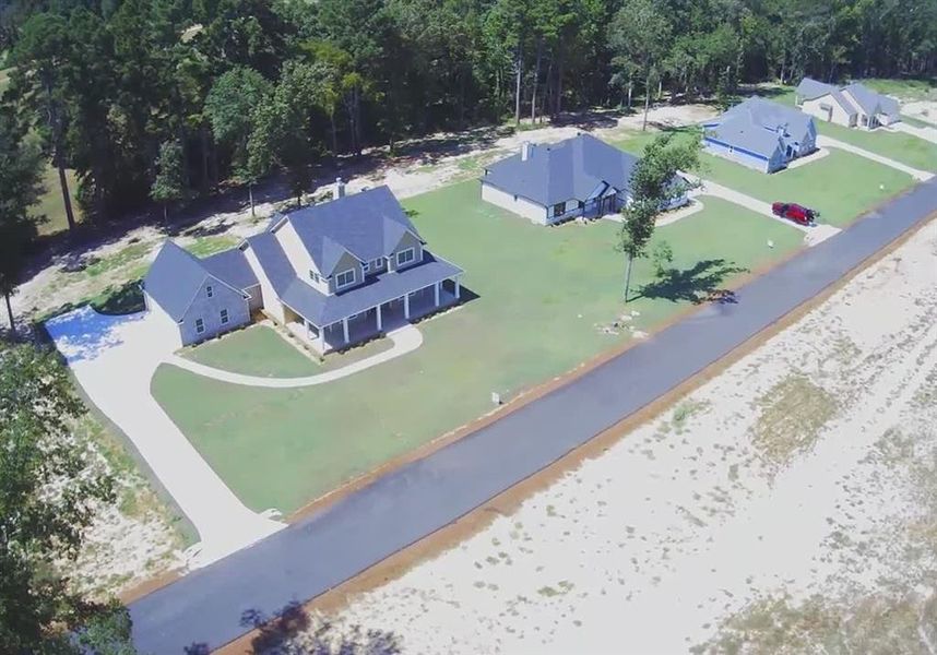 Front exterior of a new home in , Gilmer, TX, highlighting curb appeal (Image 23). Front exterior of a new home in , Gilmer, TX, highlighting curb appeal (Image 23).