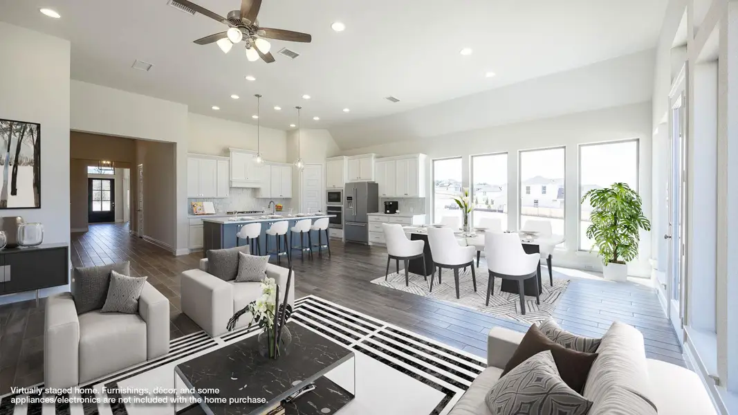 Living room featuring recessed lighting, dark wood-type flooring, and ceiling fan Living room featuring recessed lighting, dark wood-type flooring, and ceiling fan