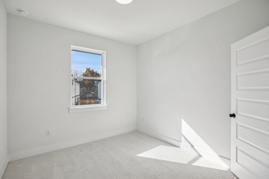 Spacious, unfurnished interior of a new home in Koenig Townhomes, Austin (Image 27).