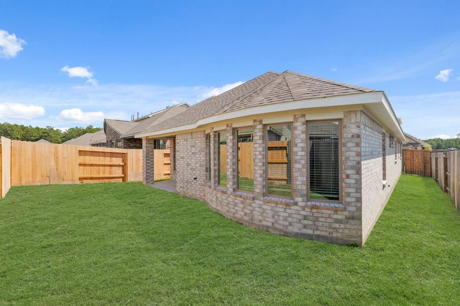 Exterior details and patio area of a home in The Trails, New Caney (Image 20). Exterior details and patio area of a home in The Trails, New Caney (Image 20).