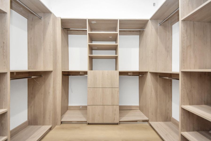 Large primary walk-in closet.