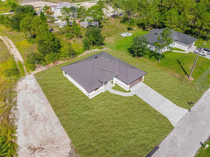 Front exterior of a new home in , Lehigh Acres, FL, highlighting curb appeal (Image 20).
