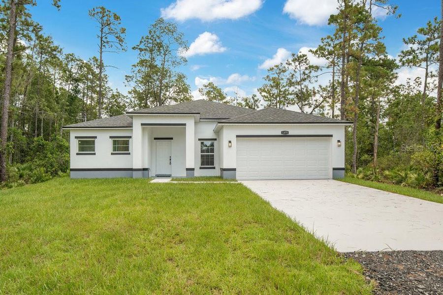 Front exterior of a new home in , Deland, FL, highlighting curb appeal (Image 2). Front exterior of a new home in , Deland, FL, highlighting curb appeal (Image 2).