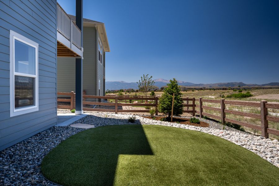 Exterior details and patio area of a home in Revel Crossing at Wolf Ranch - The Panorama Collection, Colorado Springs (Image 3).