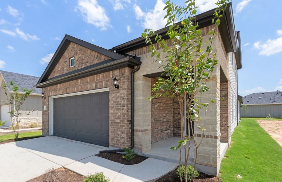 Front exterior of a new home in Del Webb Austin at Lost Pines, Bastrop, TX, highlighting curb appeal (Image 23).