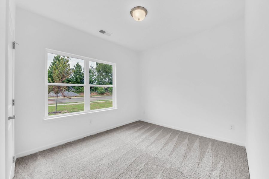 Bedroom 2 overlooks front yard.