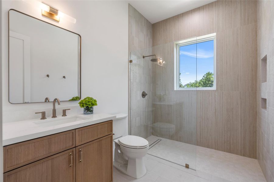 Spa-inspired secondary bath offering timeless finishes.