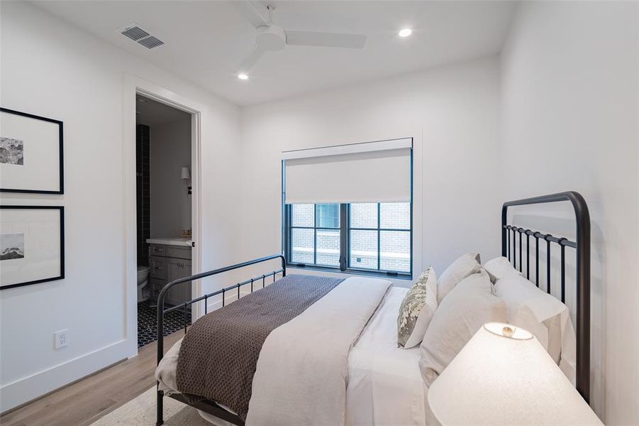 Bedroom featuring ceiling fan and light wood-type flooring