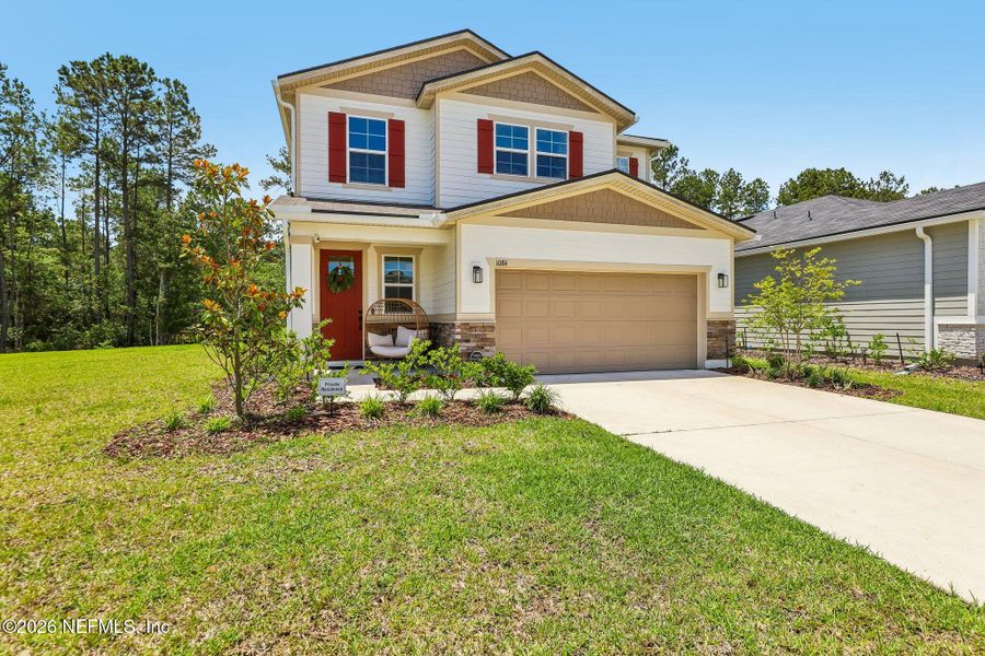 Front exterior of a new home in Seasons at Morada, St. Augustine, FL, highlighting curb appeal (Image 22).