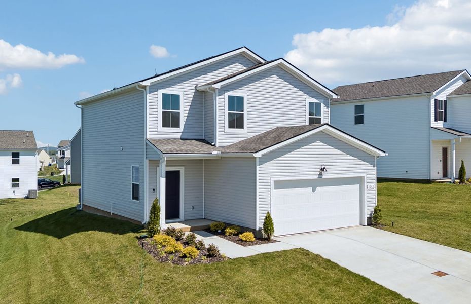 Front exterior of a new home in Highlands of Carter's Station, Columbia, TN, highlighting curb appeal (Image 17).