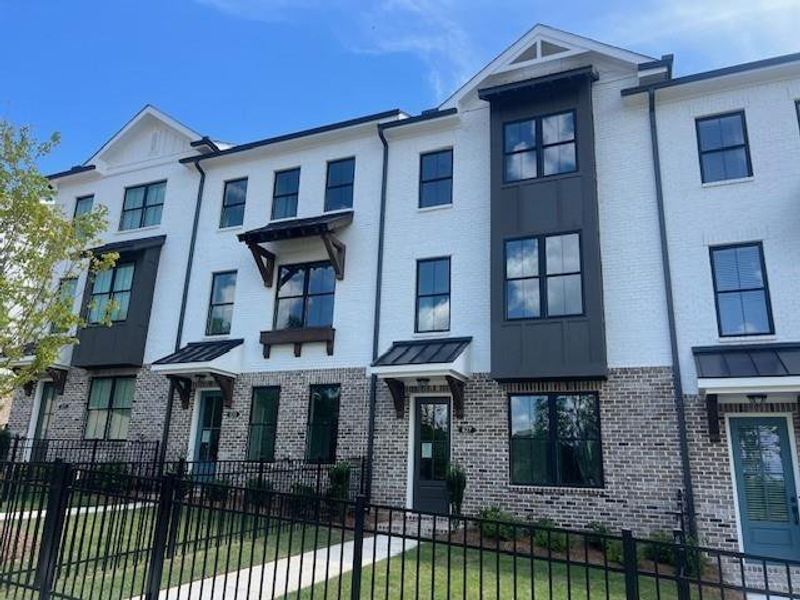 Front exterior of a new home in Palisades Townhomes, Cumming, GA, highlighting curb appeal (Image 30).