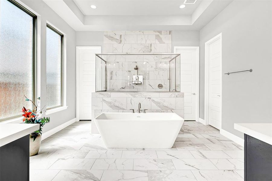 Full bathroom featuring walk in shower, a soaking tub, vanity, and light marble finish flooring Full bathroom featuring walk in shower, a soaking tub, vanity, and light marble finish flooring