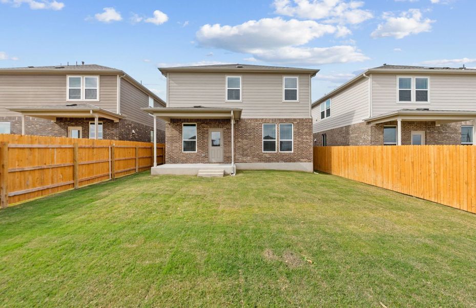 Exterior details and patio area of a home in Crosswinds, Kyle (Image 18).