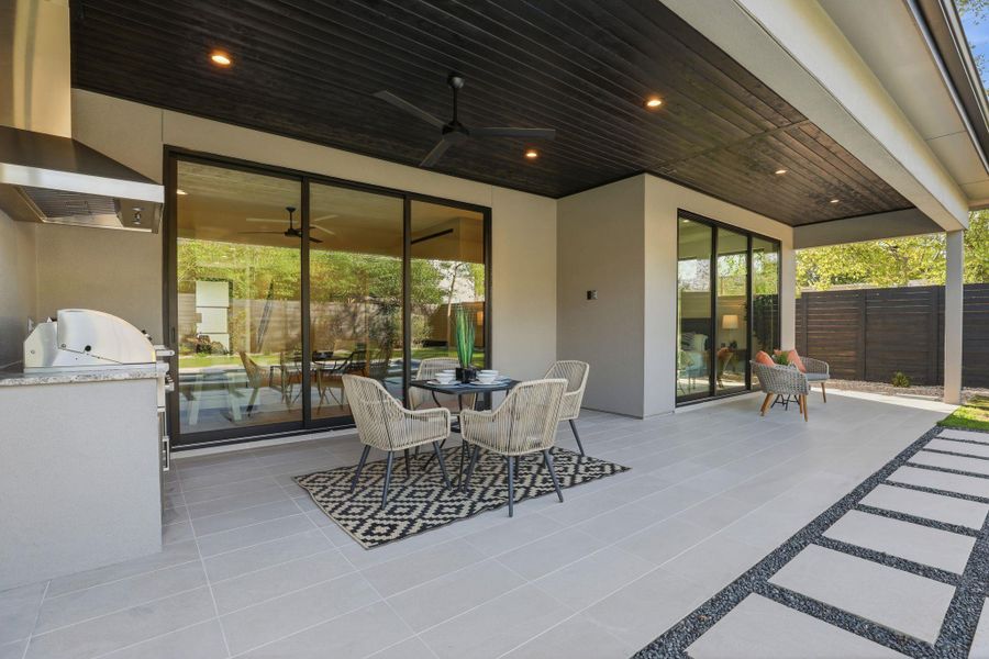 View of patio featuring outdoor dining area, area for grilling, and ceiling fan View of patio featuring outdoor dining area, area for grilling, and ceiling fan