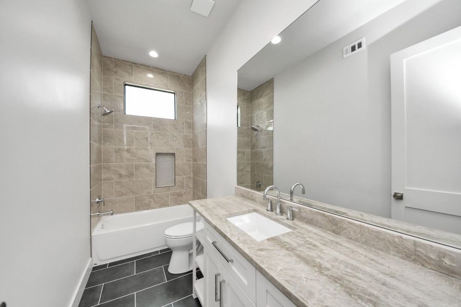 First floor full bathroom right off of the backyard. First floor full bathroom right off of the backyard.