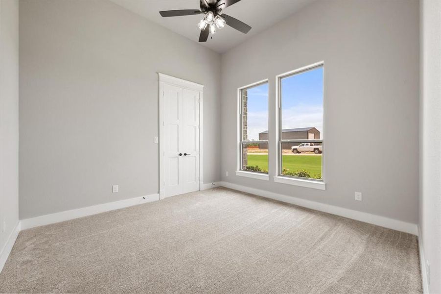 Room with vaulted ceiling and light gray walls