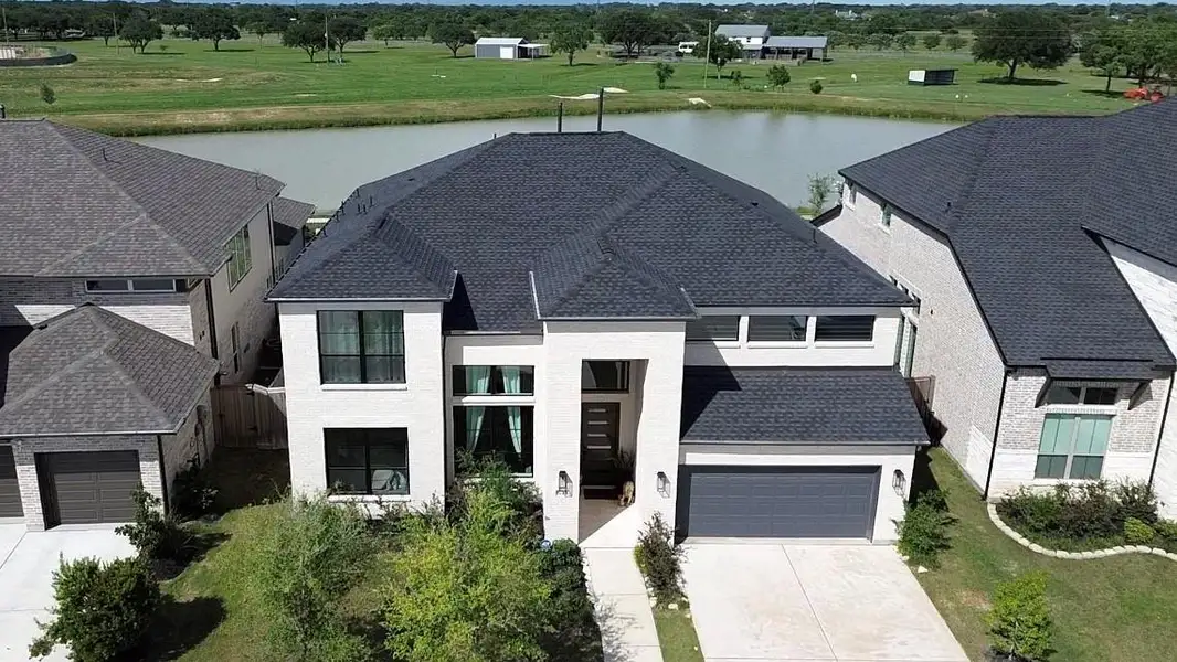 Front exterior of a new home in , Richmond, TX, highlighting curb appeal (Image 21). Front exterior of a new home in , Richmond, TX, highlighting curb appeal (Image 21).