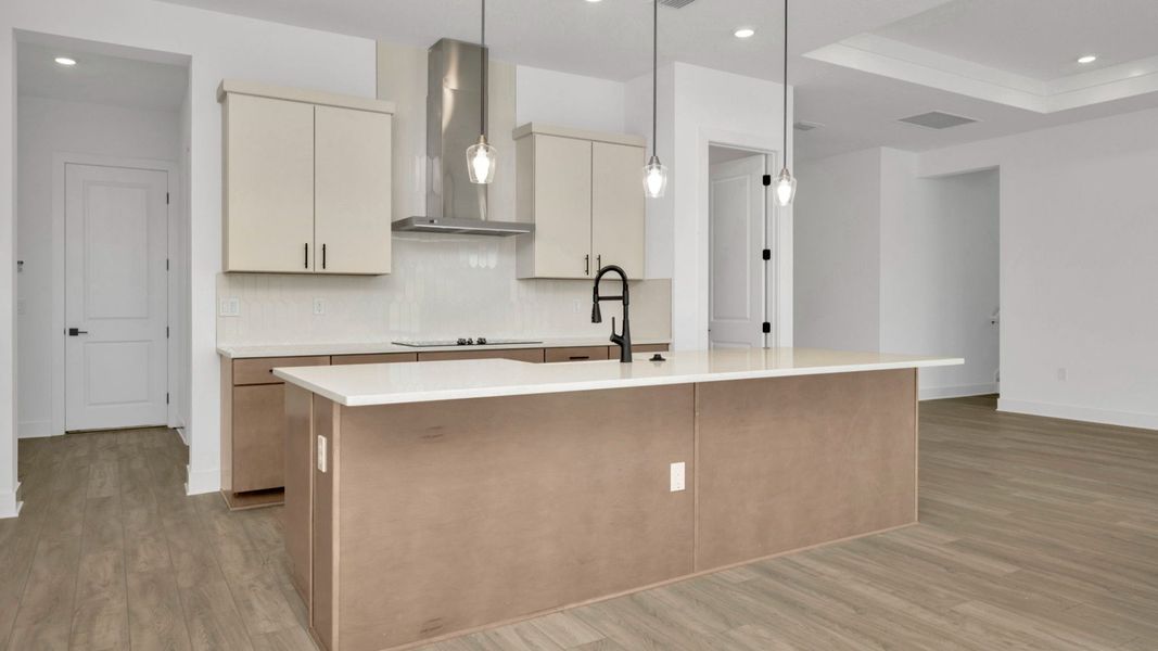 The Kitchen of a DRB Homes Grand Hawk which is offered as a home plan at Serengeti in Spring Hill, FL.