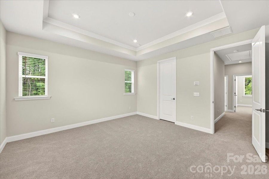Primary bedroom with tray ceilings Primary bedroom with tray ceilings