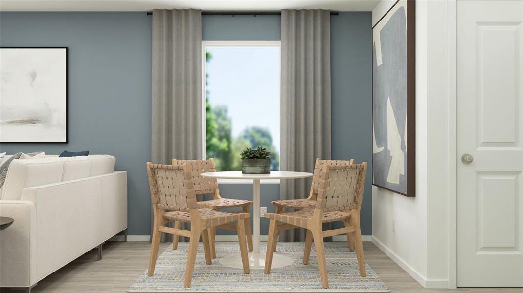 Dining room with light hardwood / wood-style flooring