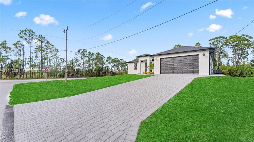 Front exterior of a new home in , Cape Coral, FL, highlighting curb appeal (Image 19).
