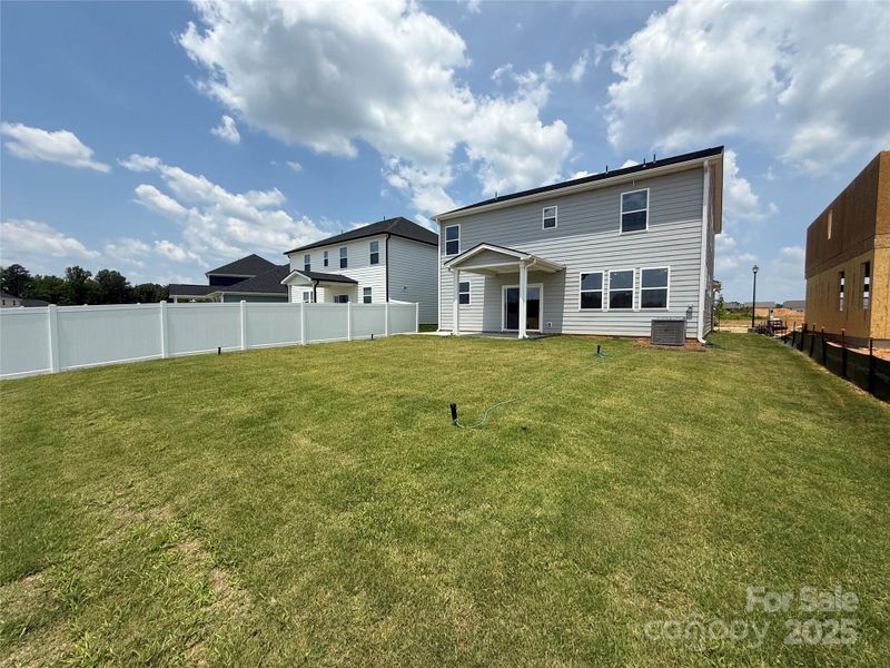 Exterior details and patio area of a home in Wellington Pointe Classic, Monroe (Image 3).