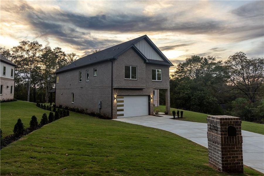 Front exterior of a new home in , Lawrenceville, GA, highlighting curb appeal (Image 2).