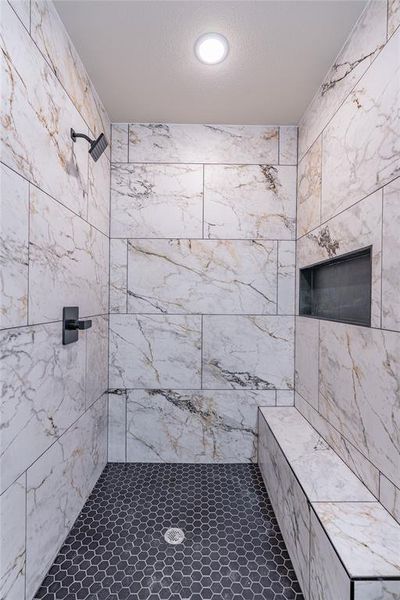 Bathroom with a tile shower