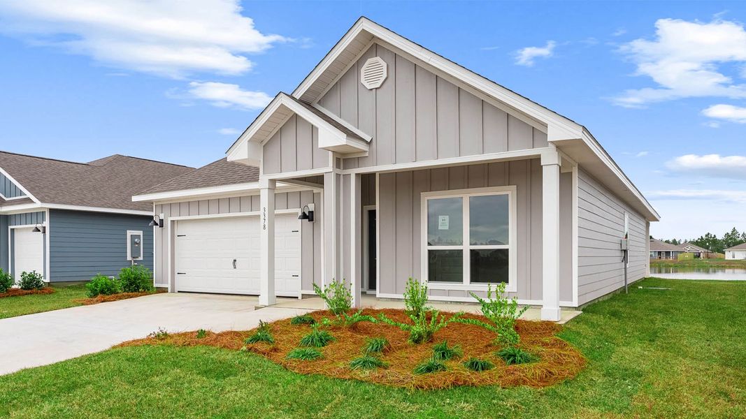 Front exterior of a new home in Hodges Bayou Plantation, Panama City, FL, highlighting curb appeal (Image 2). Front exterior of a new home in Hodges Bayou Plantation, Panama City, FL, highlighting curb appeal (Image 2).