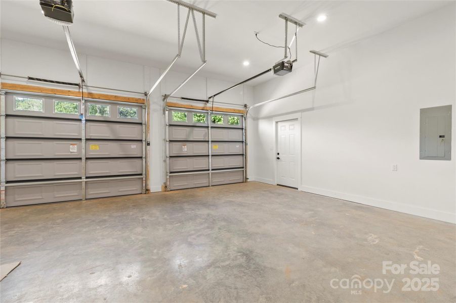 Large over size two car garage with extra tall ceilins. Side entrance door. Quiet openers feauturing MyQ technology.