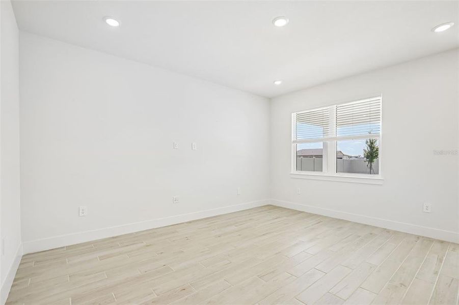 Spacious, unfurnished interior of a new home in Magnolia Bay - Reserve Series, Nokomis (Image 26).