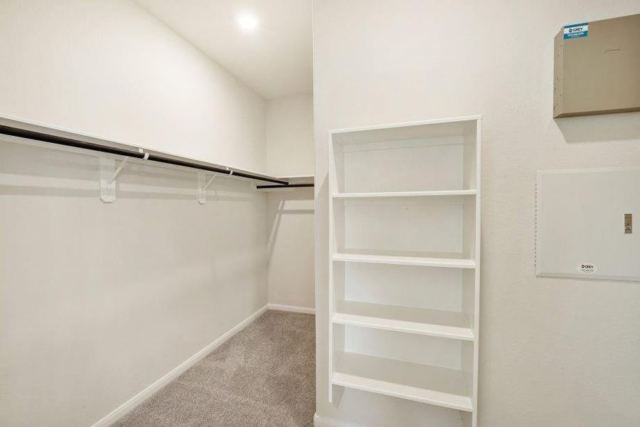 Step into this spacious walk-in closet, offering ample shelving and hanging space for all your wardrobe needs. Thoughtfully designed for organization and style, it’s perfect for keeping your belongings neat and accessible.