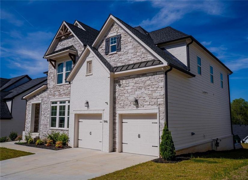 Front exterior of a new home in , Woodstock, GA, highlighting curb appeal (Image 23).