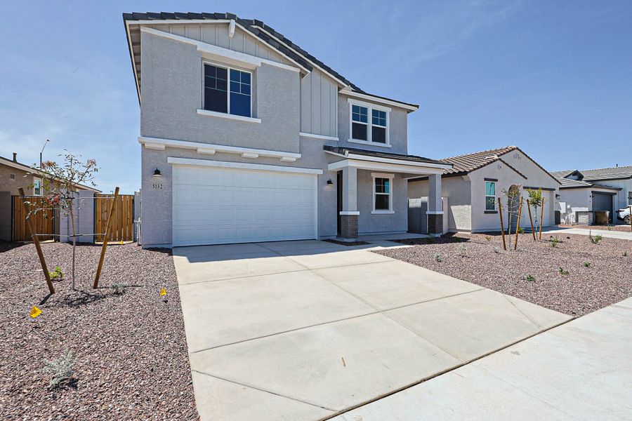Front exterior of a new home in Montaña Vista, Buckeye, AZ, highlighting curb appeal (Image 1). Front exterior of a new home in Montaña Vista, Buckeye, AZ, highlighting curb appeal (Image 1).