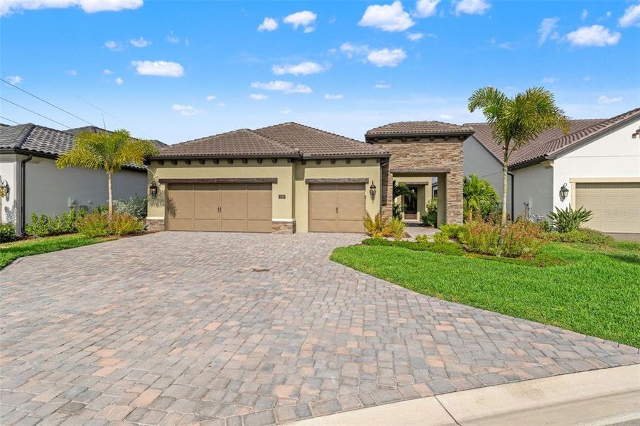 Front exterior of a new home in , Nokomis, FL, highlighting curb appeal (Image 1). Front exterior of a new home in , Nokomis, FL, highlighting curb appeal (Image 1).